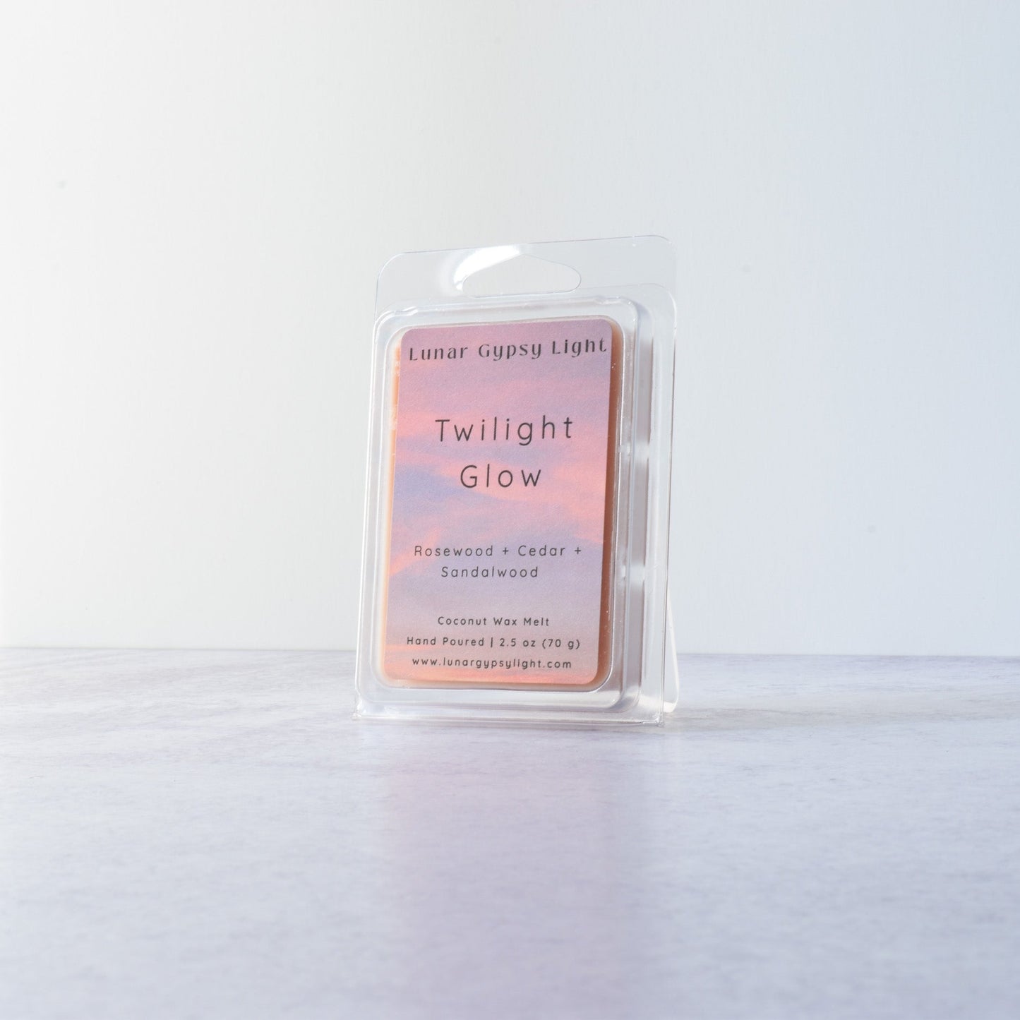 Wax melt container labeled 'Twilight Glow' on a white background