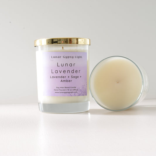 Candle with a label reading 'Lunar Lavender' on a white background