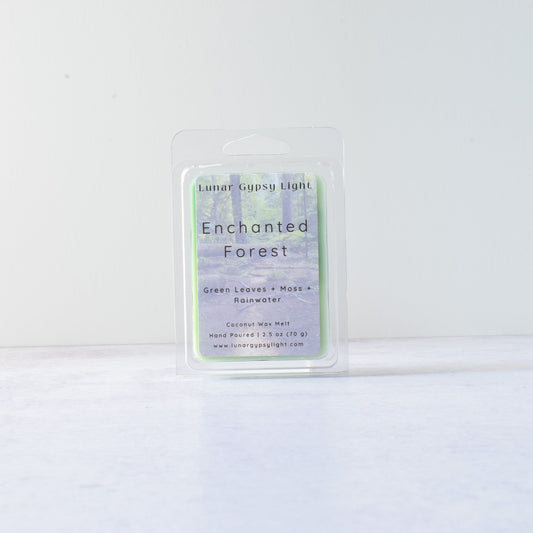 Wax melt packaging labeled 'Enchanted Forest' on a white background
