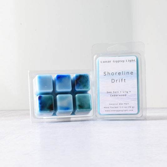 Packaged wax melts with a label "Shoreline Drift" on a white background