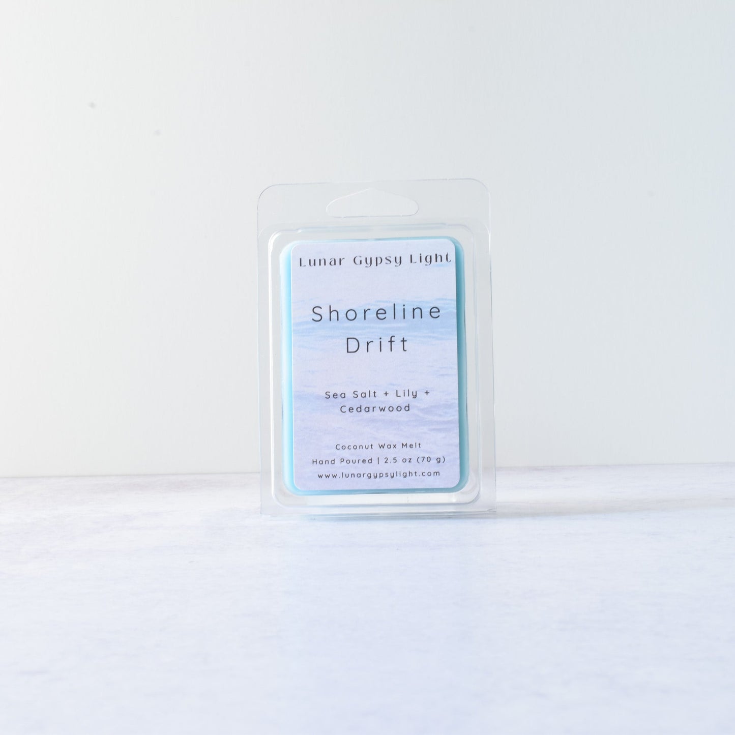 Product packaging labeled 'Shoreline Drift' Wax Melt on a white background