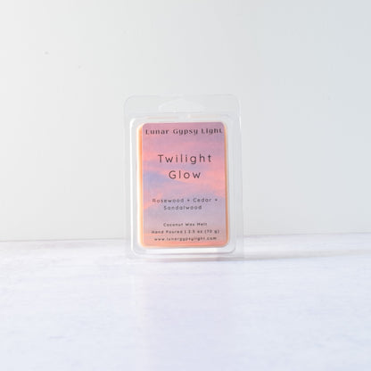 Wax melt with product packaging with 'Twilight Glow' on a white background
