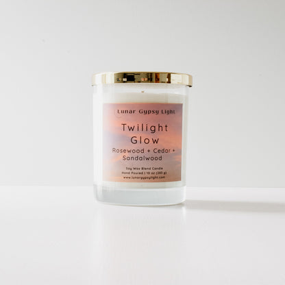 Candle labeled 'Twilight Glow' with a gradient label on a white background and gold lid